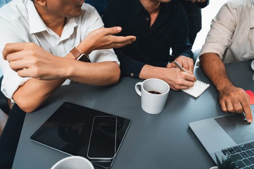 Group of diverse office worker employee working together on strategic business marketing planning in corporate office room. Positive teamwork in business workplace concept. Prudent