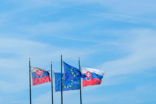 The flags of Slovakia and European Union hangs on the mast