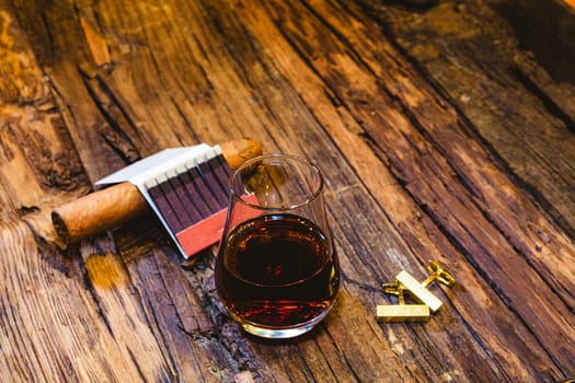 Close Up of a Glass of Sweet Madeira Fortified Wine on wooden table.