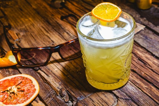 Whiskey Sour Drink Lighting on wooden table. Shallow dof