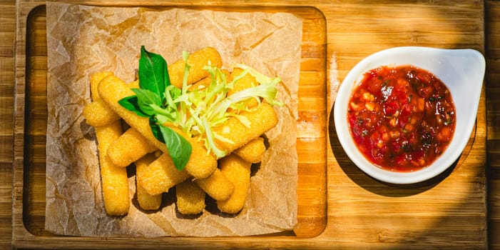 Crispy Halloumi cheese sticks with Chili sauce. Shallow dof.