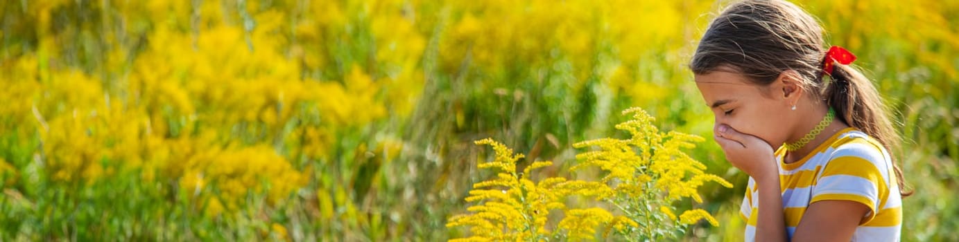 A child is allergic to ragweed blooming in the park. Selective focus. Nature.