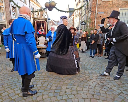 Deventer, Netherlands, December 16, 2023: Queen Victoria meets Charles Dickens during the Dickens festival in Deventer in the Netherlands