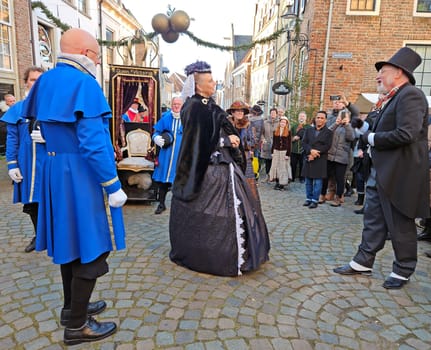 Deventer, Netherlands, December 16, 2023: Queen Victoria meets Charles Dickens during the Dickens festival in Deventer in the Netherlands