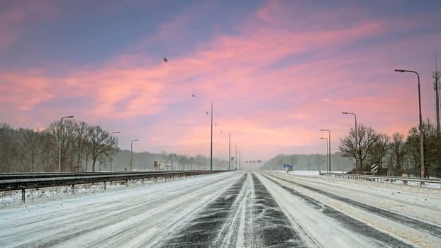 Driving in a snowstorm on the highway A1 near Amsterdam in the Netherlands in winter