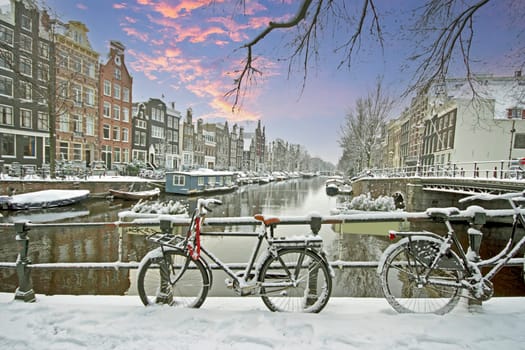 Amsterdam in winter in the Netherlands at sunset