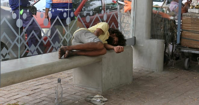 salvador, bahia, brazil - january 5, 2024: beggar sleeping on the street in the city of Salvador