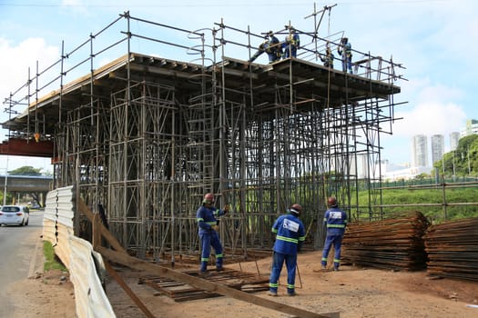 salvador, bahia, brazil -  february 5, 2024: Workers are seen during the construction of a viaduct in the city of Salvador.