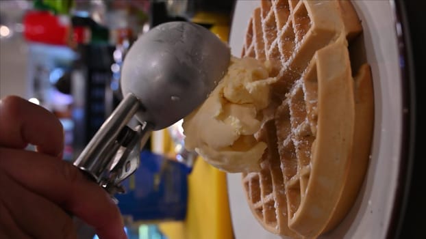 Plate of delicious Chocolate Belgian Waffles with ice cream on table