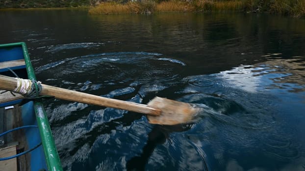 Boat rides on Lake Huallhua located in Huancaya south of Lima - Peru. A palette is visible up close. Clear water.