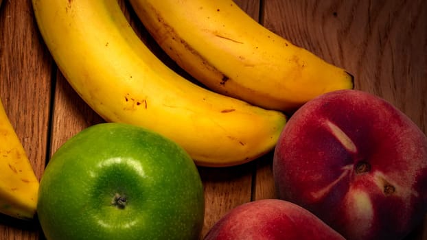 Mix of fresh fruits on wooden table