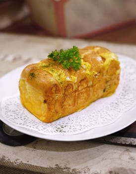 Fresh grilled delicious sandwich with topping and filling plated in white plate, just freshly baked in the restaurant