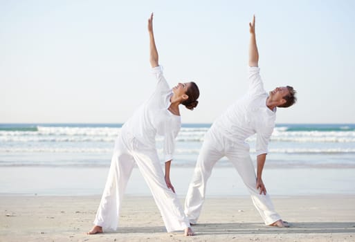 Couple, yoga and pose, fitness on beach for zen and wellness, travel and mindfulness with holistic healing. People outdoor, exercise and balance, workout together for bonding with sea and nature.