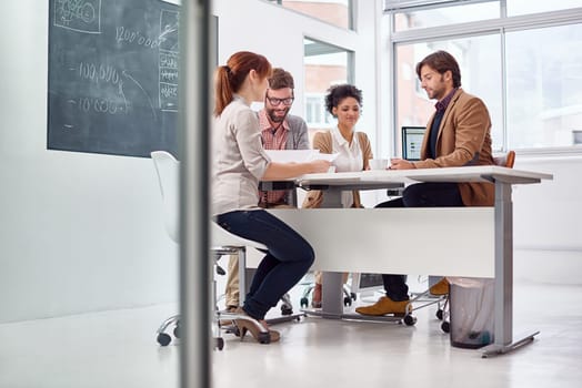 Business people, planning and meeting in office, diversity and brainstorming on project for decision. Men, women or communication with paperwork on table, problem solving or consultant in company.