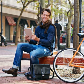 Portrait, outdoor and smile with man, tablet and bicycle with connection and relax with internet and social media. Person, funny and New York with guy and technology with digital app or communication.