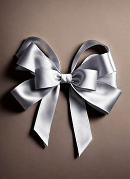 white bow on a gray background. selective focus. happy.