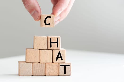 Word Chat on board game square plastic tile pieces, isolated on a white background. High quality photo