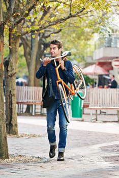 Man carrying his bicycle, travel and sunshine in a city, sustainability and commute for adventure and vacation. Netherlands, person and guy with a bike and eco friendly with transportation and summer.