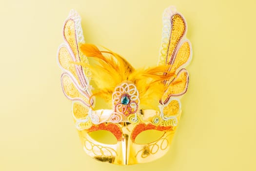 Happy Purim carnival accessories. Carnival mask for Mardi Gras celebration isolated on pastel green background, jewish holiday, Purim in Hebrew holiday carnival ball, Venetian mask