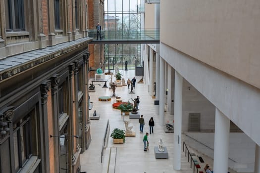 Copenhagen, Denmark - January 20, 2024: Sculptures and people inside the National Gallery of Denmark