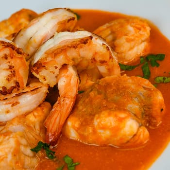 Recipe for Armorican-style monkfish tail, prawns, flambees with cognac, High quality photo