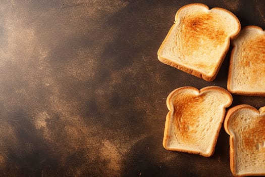 Four slices of toasted bread on a dark surface.