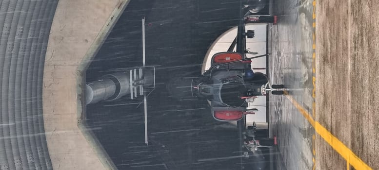 Vertical photo of a NATO fighter jet inside the hangar, prepped for takeoff, featuring copy space, illustrating the aircraft's readiness and the strategic anticipation of its mission.