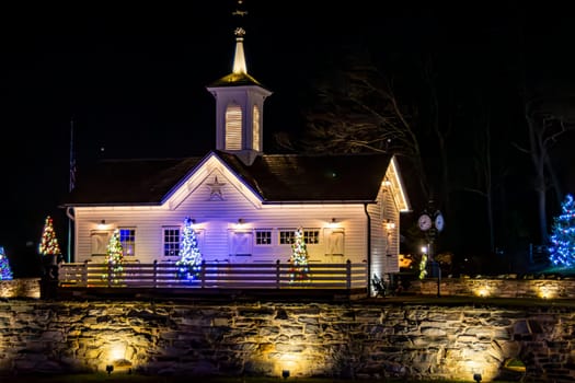 Quaint White Chapel Adorned With Twinkling Christmas Lights And Festive Decorations, Nestled Against A Night Sky, Radiating A Sense Of Peace And Holiday Cheer.
