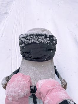 Wintry Walk: A Fathers Journey With Child in Snowy Silence. Vertical photo