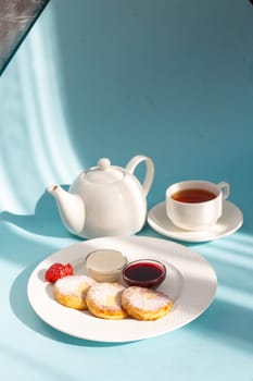 Enjoy a wholesome breakfast with fluffy cottage cheese pancakes topped with jam, fresh strawberries, and a dollop of sour cream. Energize your day with this delicious and nutritious meal.