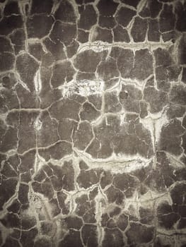 Grey cracked concrete wall texture. Abstract background of crack concrete wall.