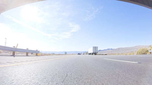 Embarking on a road trip from Nevada to California, driving on Highway 15 during the day offers scenic views and an exciting journey between states.