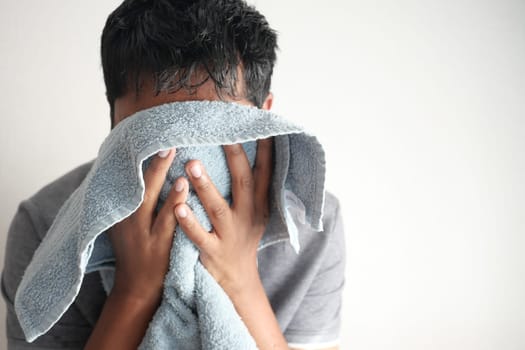 young Man drying his face