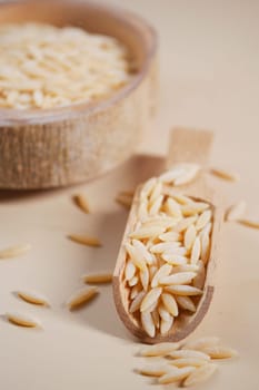 Wooden bowl with white long rice basmati