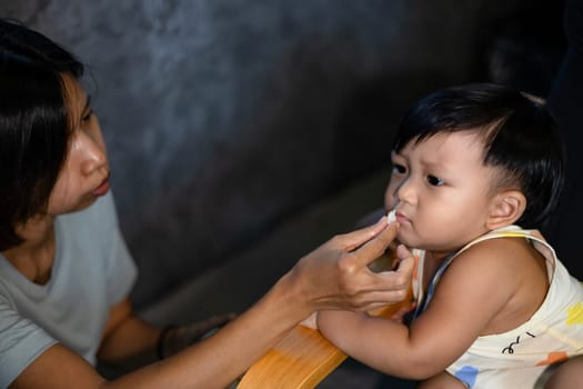 Portrait of Little boy child with no appetite in front of the meal. Concept of loss of appetite.