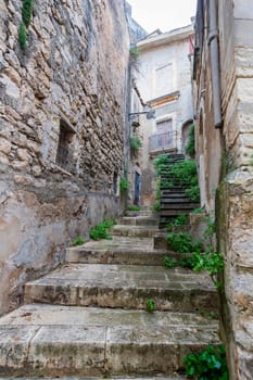 Small stone stairs entry to a house in the Ragusa Ibla city in Sicily, Italy