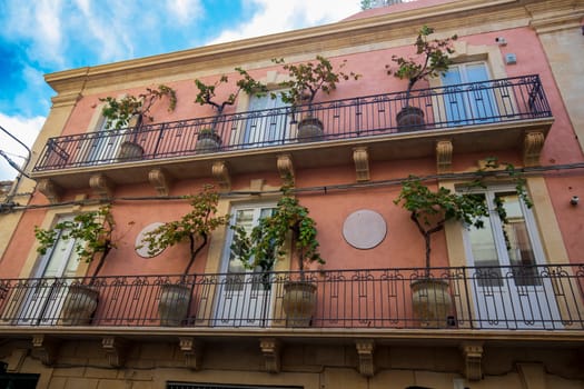Sicily. One of the spectacular balconies with plants in the city 