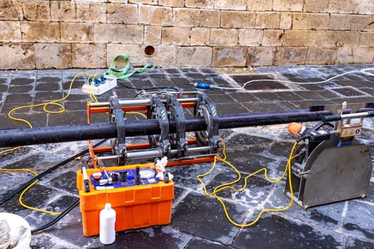 Butt fusion welding machine pipe welding machine for connecting water pipes together during a new building water supplies project. 