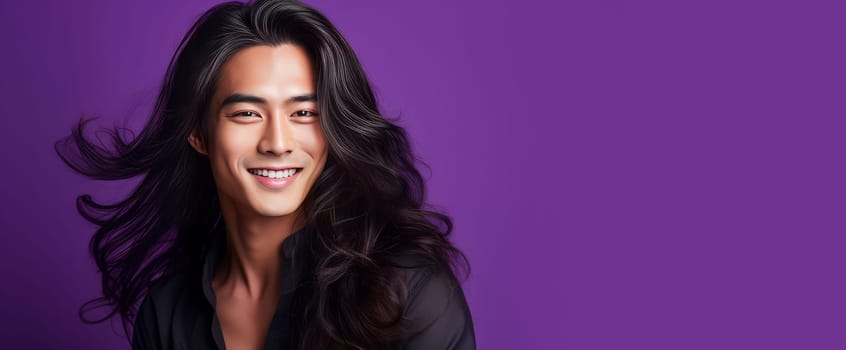 Elegant handsome smiling young Asian man with long hair, on purple background, banner, copy space, portrait. Advertising of cosmetic products, spa treatments, shampoos and hair care products, dentistry and medicine, perfumes and cosmetology for men