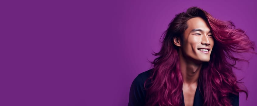 Handsome young male guy smile Asian with long red hair, on purple background, banner, copy space, portrait. Advertising of cosmetic products, spa treatments, shampoos and hair care products, dentistry and medicine, perfumes and cosmetology for men