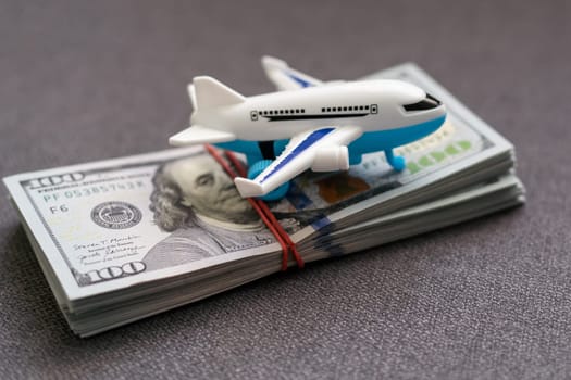 Model plane, airplane, money. Flat lay design