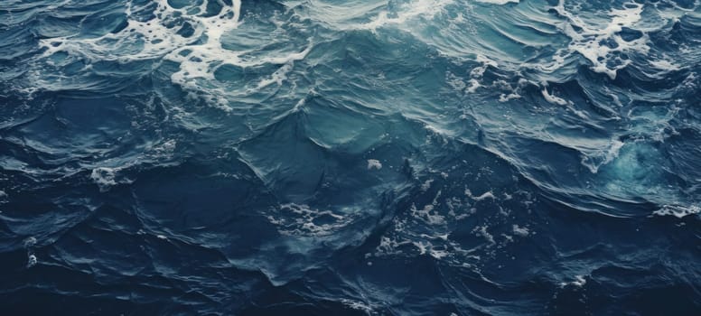 Dynamic blue sea waves swirling with foam