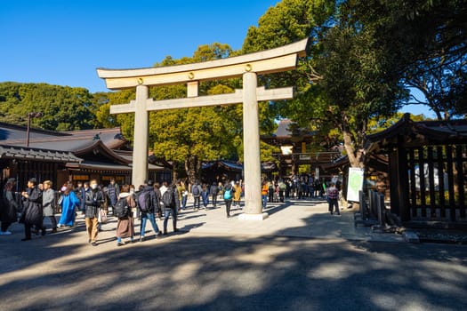Tokyo, Japan. January 8, 2024. view of the Torii gate at ther entrance of  the Meiji Shinto Temple park in the city center
