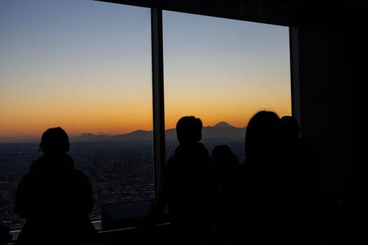 Tokyo, Japan. January 9, 2024. people looking at the view with Mount Fuji in the background from Tokyo Metropolitan Government Building North Observatory in the city center
