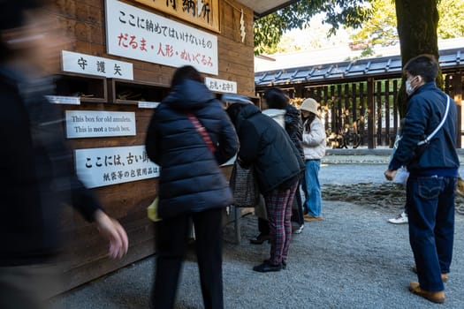 Tokyo, Japan. January 8, 2024. the faithful in the internal courtyards of Meiji Shinto Temple in the city center