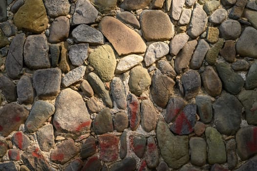 old wall made of real stone in the sun 3