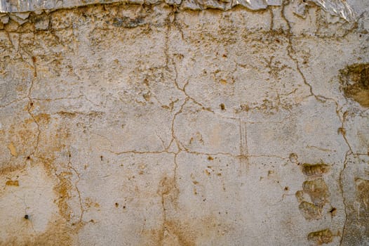 old plaster wall with cracks 2