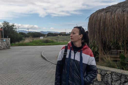 portrait of a woman in a red blue and white jacket in Cyprus 1