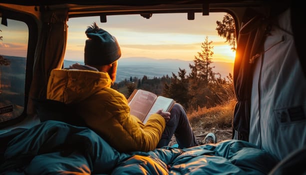 A man sits in the back of his car reading a book campsite at sunset. Generative AI.