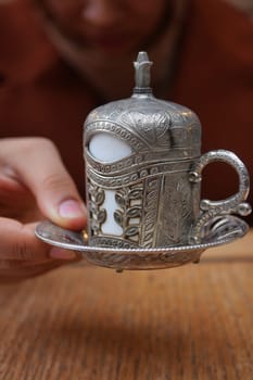 a cup of turkish coffee on table .